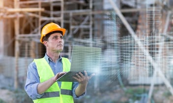 Architect using laptop holographic computer technology
