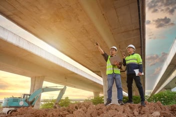 Civil engineers inspect elevated highway structure