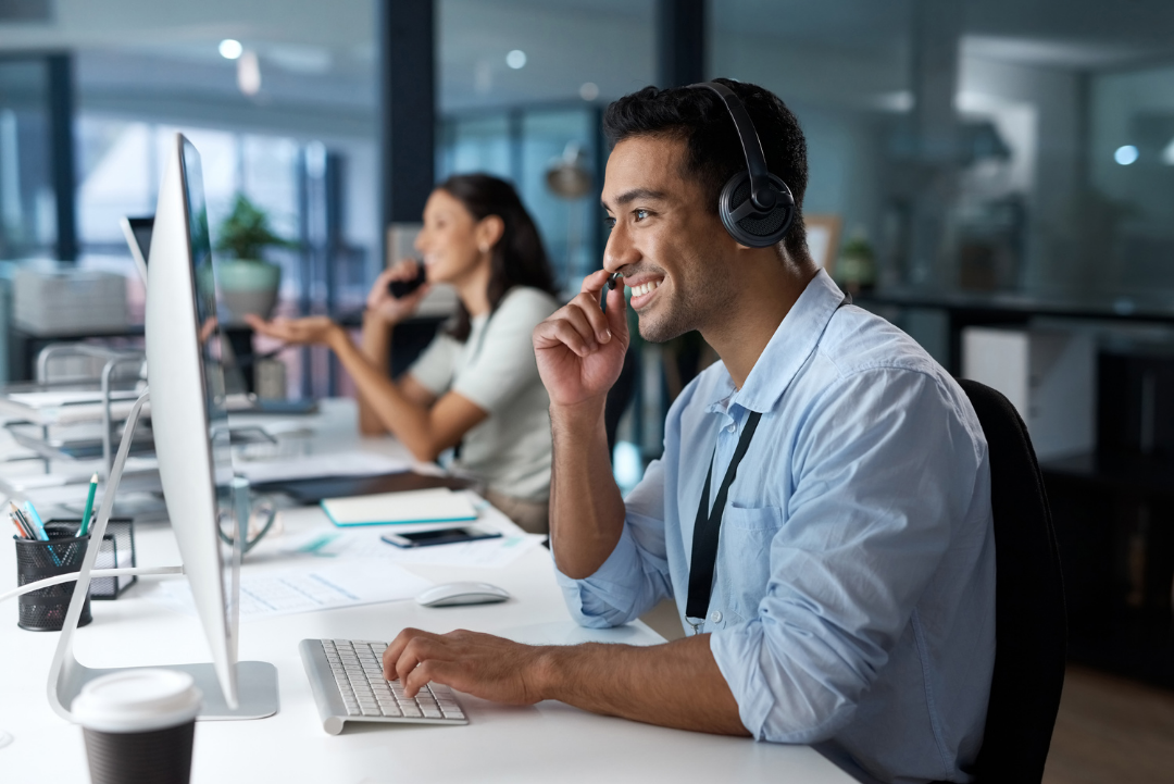 Office workers on phone call and laptops supporting customers